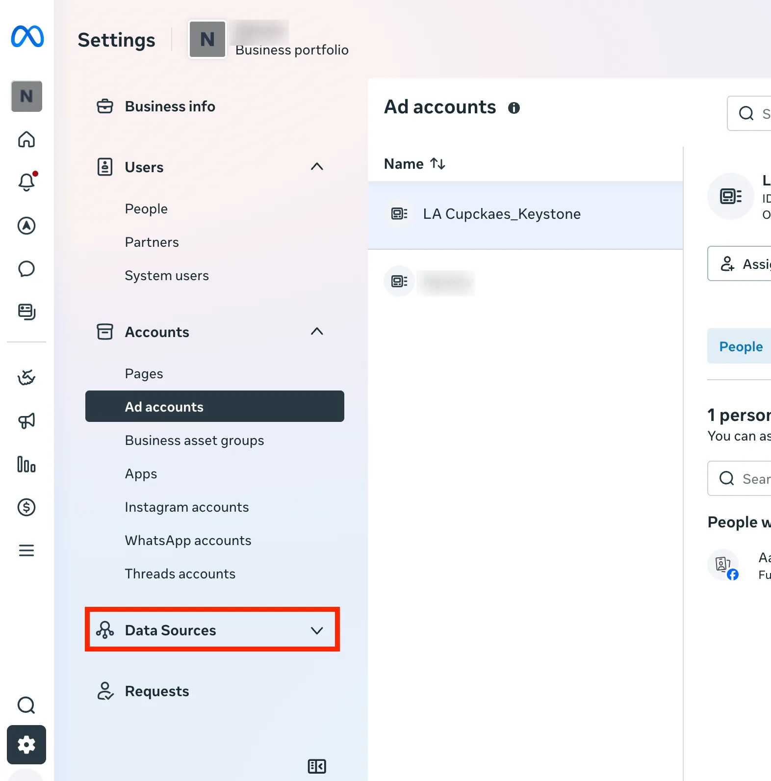 Business Suite Settings with Data Sources highlighted in the left column and the Ad accounts list showing the new account.